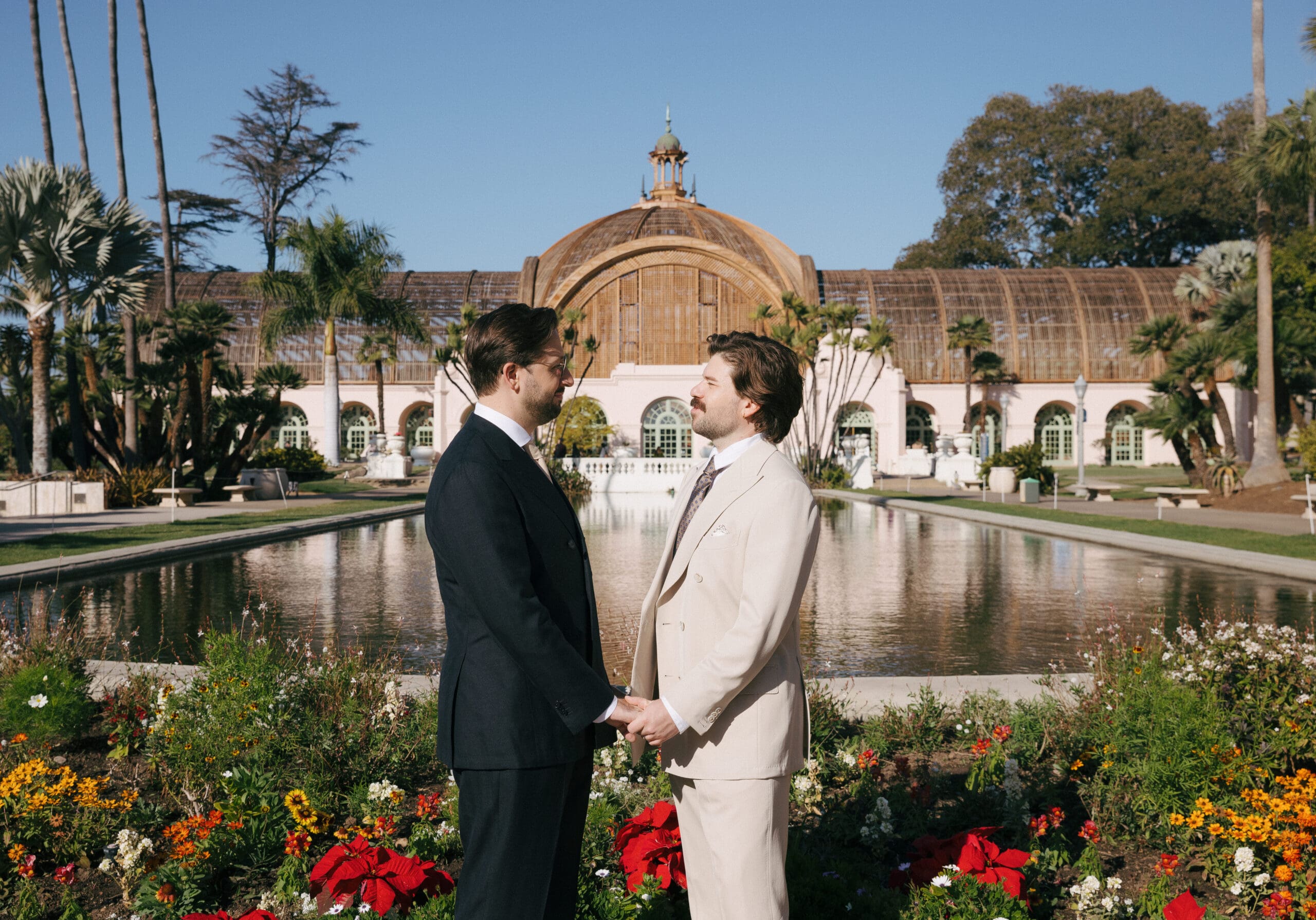 Dreamy Balboa Park elopement featuring a same-sex couple from Atlanta. Morning light, romantic courthouse vows, and portraits at the iconic Organ Pavilion and newly reopened Botanical Building. Perfect inspiration for a San Diego elopement. #BalboaParkElopement #SanDiegoElopement #CourthouseWedding #LGBTQWedding #ElopementInspiration